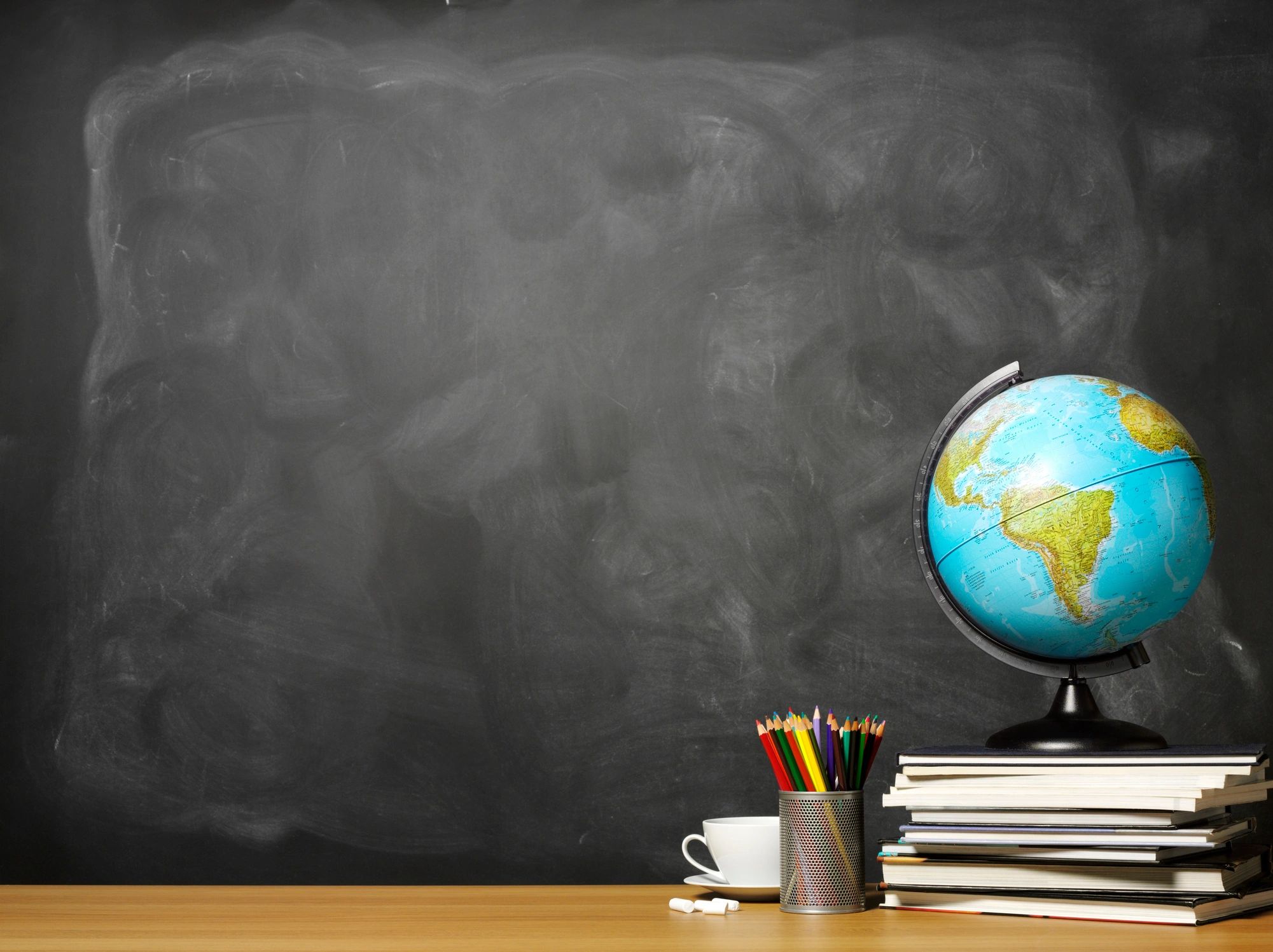 Globe on a stack of books on a desk