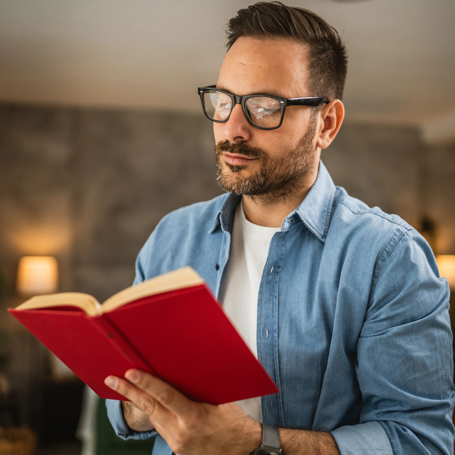 Portrait of a man reading a book